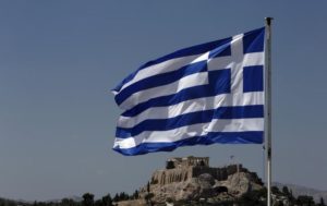 544996-a-greek-flag-flutters-in-front-of-the-acropolis-hill-in-athens